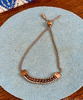 Full view of the bracelet showing slider and rhinestone bar