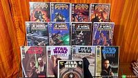 Group shot of 13 bagged Star Wars comics on display rack