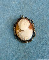 Front view of sterling shell cameo pendant