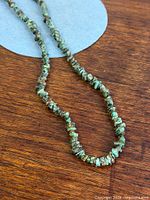 Full view of turquoise chip bead necklace laid out