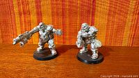 Front view of both Ogryn miniatures on bases