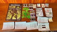 Overall lot showing codex, green rod sprues, multiple decal sheets, reference cards