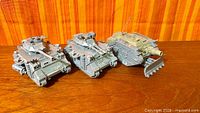 Three assembled Leman Russ tanks side by side