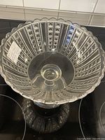 Top view showing scalloped rim and three-panel diamond pattern