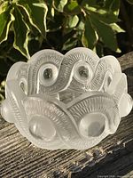 Full view of Lalique frosted and clear crystal bowl on wood surface