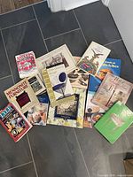 Group shot of all 14 books spread on floor