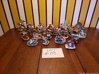 Group shot of 21 mouse figurines arranged on table