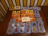 Overview of all 45 Charming Tails pins on cards and in boxes