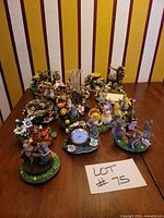 Group shot of all Charming Tails figurines on table