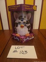 Front view of boxed Furby showing model and coloration
