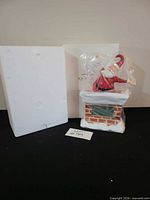 Clock figure in plastic with styrofoam and outer box