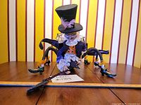 Front view of spider doll showing costume and legs