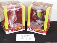 Both boxed Shrek and Donkey Fabriche figurines front view