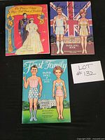 Front covers of all three paper doll books