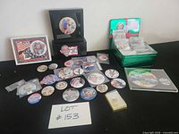 Entire lot with buttons laid out, display case, tin box, bubble wrap