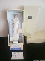 Full view of boxed Princess Diana doll with open outer box
