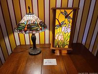 Both lamps side by side on table, showing stained glass designs and cords