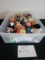 Bin containing multiple Ty Beanie Babies plush animals