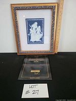 Framed plaque with certificate and scale reference