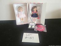 Entire lot: doll in pastel dress, extra patriotic outfit in box, hat, plush bear