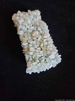 Bracelet laid flat showing clustered aventurine chips