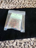 Front view sealed bag labelled Kashmir showing multicolored resin
