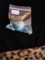 Lapis lazuli sphere in plastic bag
