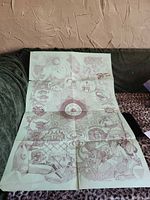 Full view of folded poster showing zodiac artwork