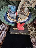 Front view Ma'at statue, wings spread, base visible