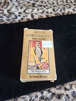 Front of boxed tarot deck showing title and artwork The Magician