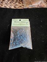 Front of Western Waters packet showing label and blue resin