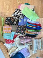 Overall view of assorted fabric pieces, trim and ribbon