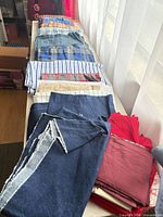 All fabric pieces laid out lengthwise on table