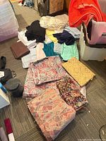 Fabric pieces and plastic bins overview