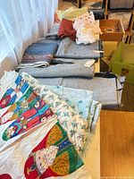 Overview showing multiple folded fabrics and trims