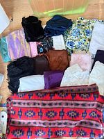 Top view of assorted fabric pieces spread on floor