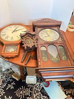 All three clocks and accessories on table