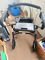 Top view showing handle, brakes, seat and wheels