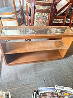 Front view showing entire display shelf, glass top, two shelves