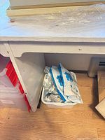 Area under table, unrelated items visible