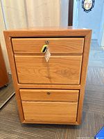 Front view showing two drawers, lock and key