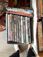 Small box of 14 DVDs/Blu-rays including Pixar and Tarantino titles