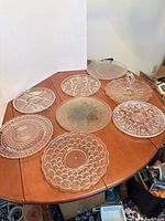 All eight glass serving pieces displayed on table