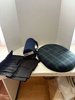 Lumbar roll, round tartan cushion, waist trainer belt overview