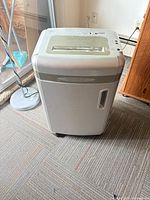 Front view of grey micro-cut shredder on casters