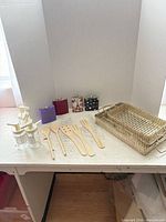 All items arranged together: trays, utensils, flasks, dispensers