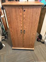 Front view of closed oak veneer cabinet