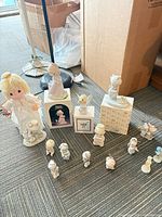 Entire lot showing cloth doll, boxed figurines, loose figurines and ornaments