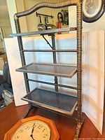 Shelf and part of clock showing materials and condition