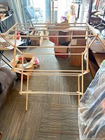 Rack fully assembled showing multi-tier wooden dowels